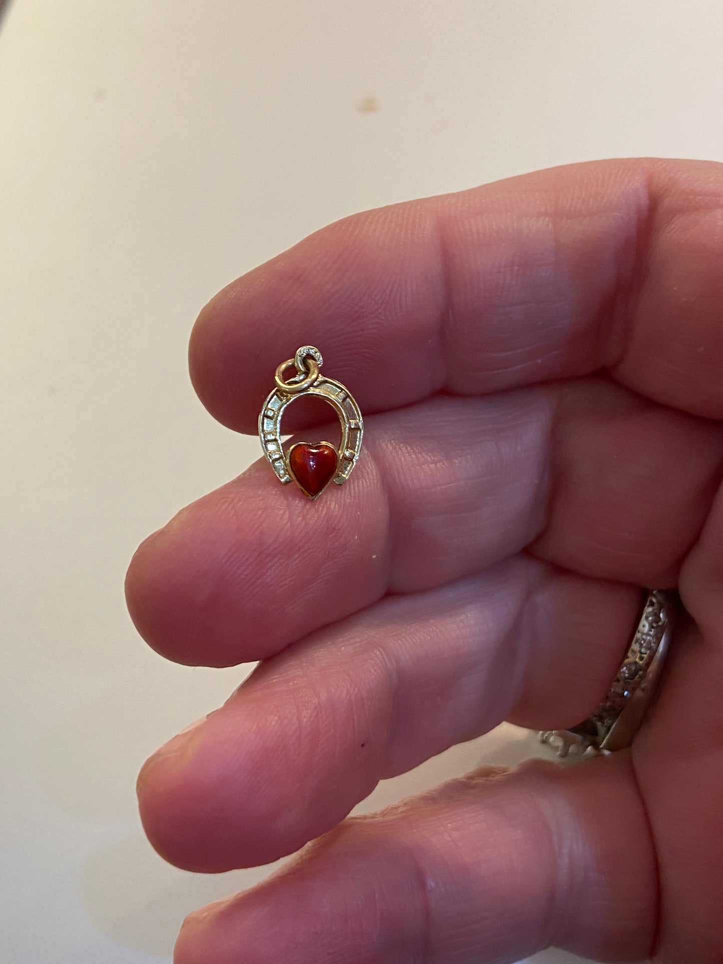 14ct vintage horseshoe with red enamel heart . 585