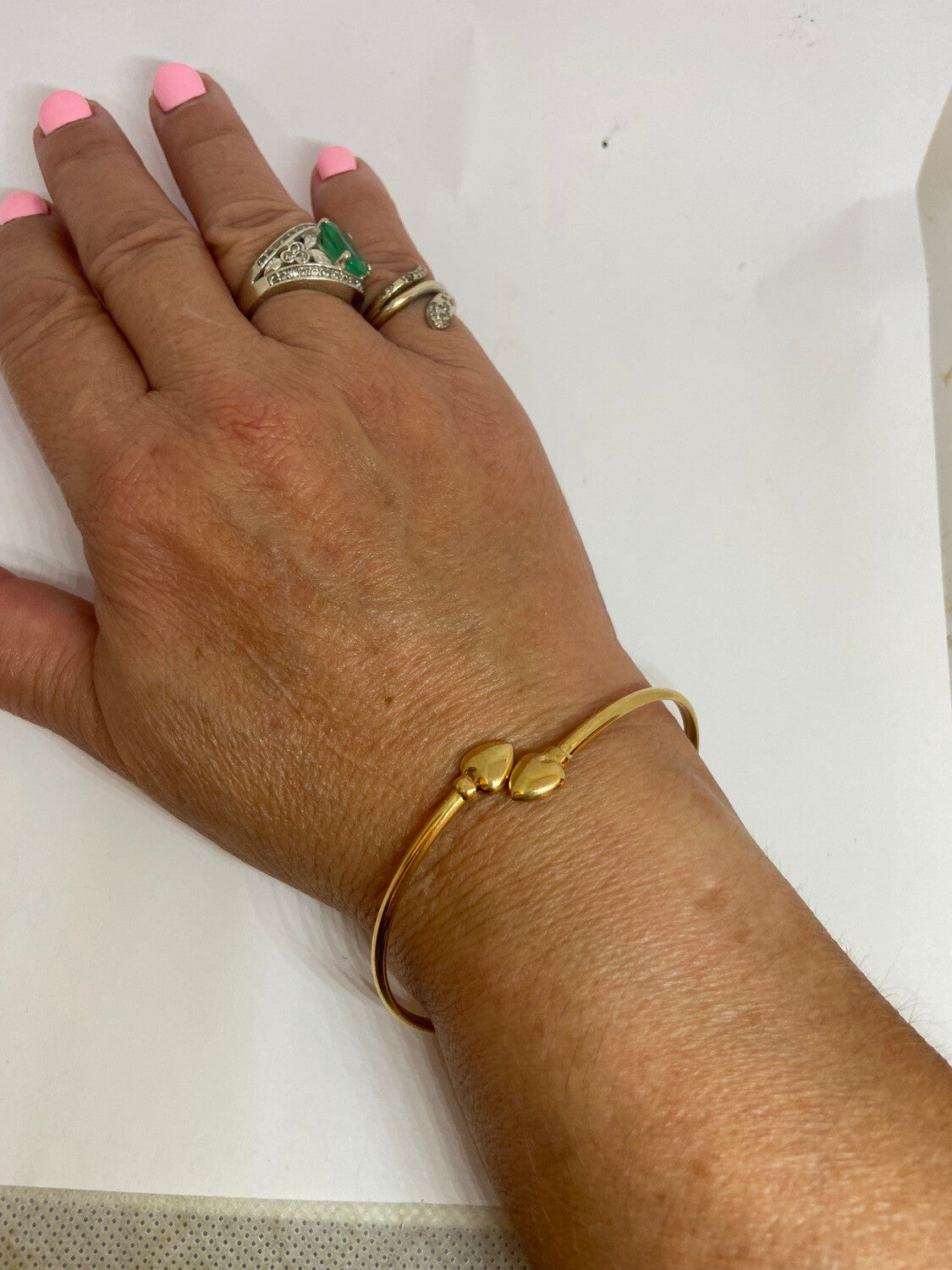 9ct pre owned bangle with two hearts