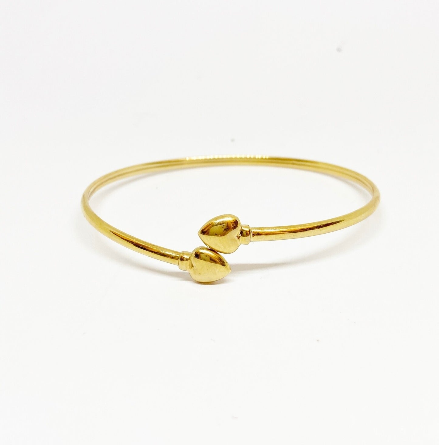 9ct pre owned bangle with two hearts
