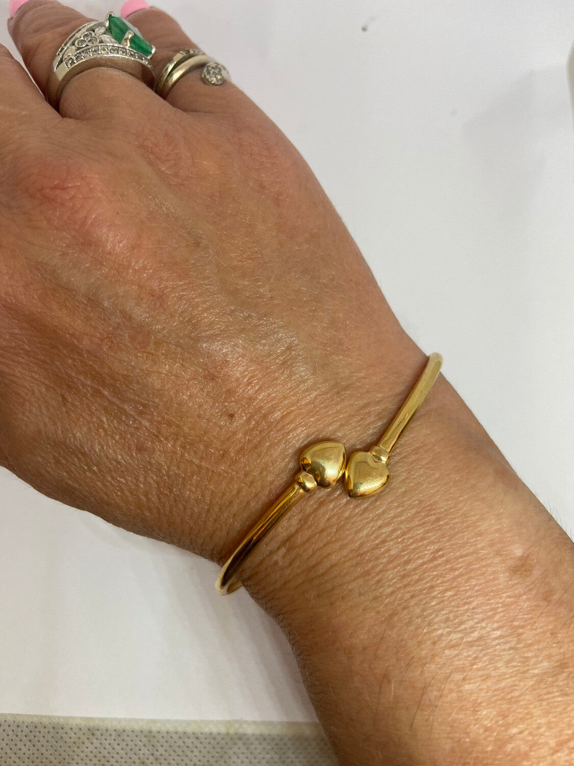 9ct pre owned bangle with two hearts