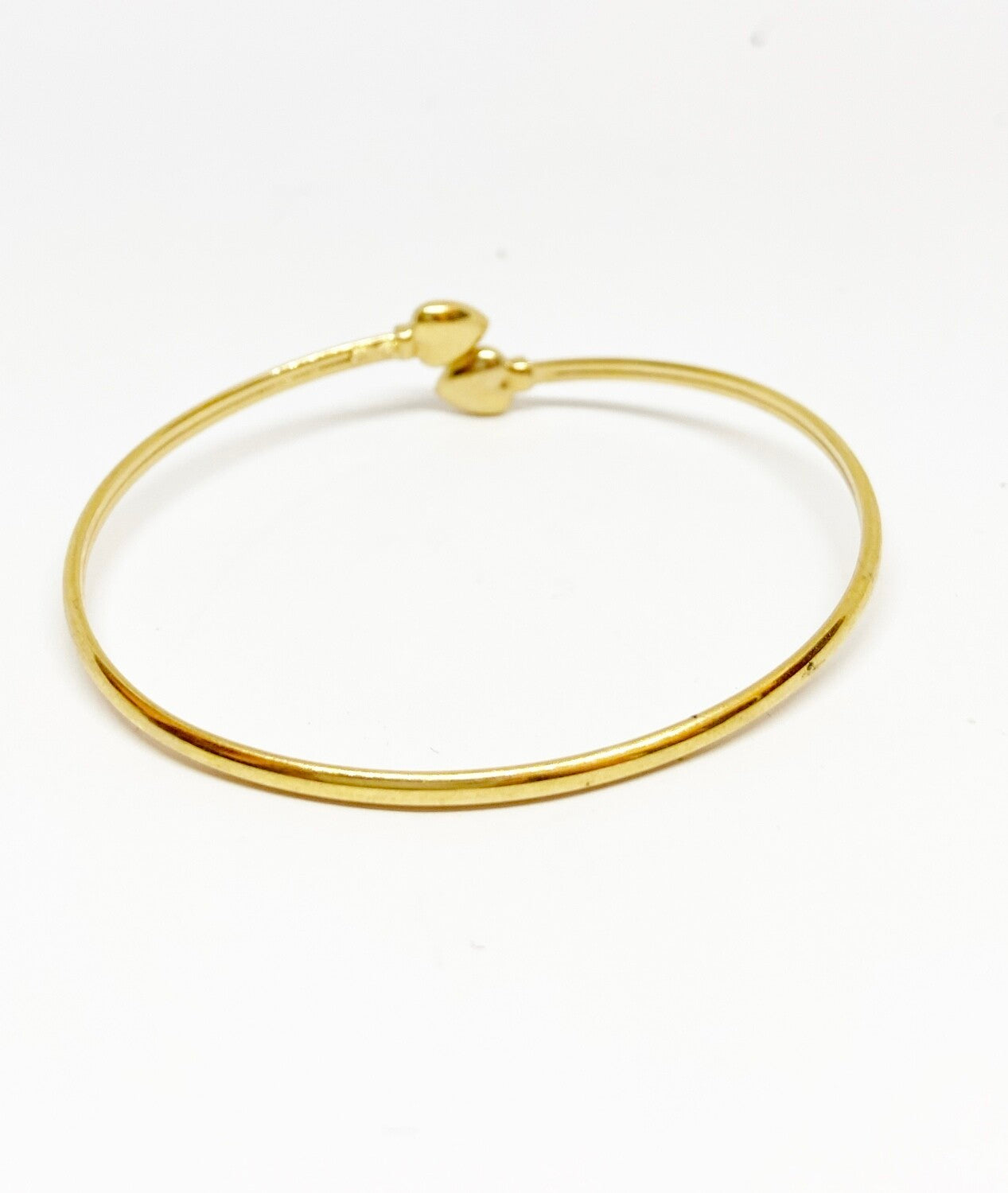 9ct pre owned bangle with two hearts