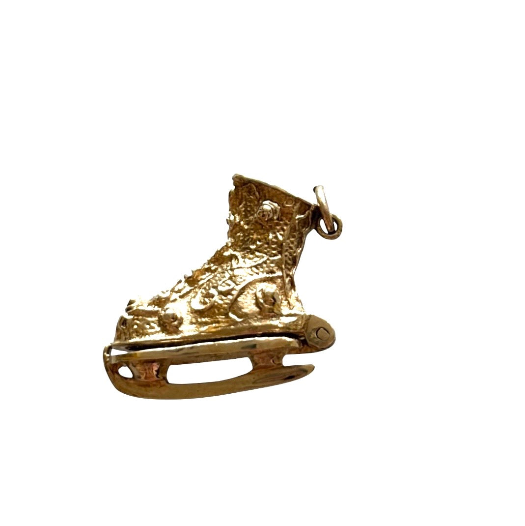 9ct vintage ice skate charm circa 1966 London with enamel skater inside. 6.2g