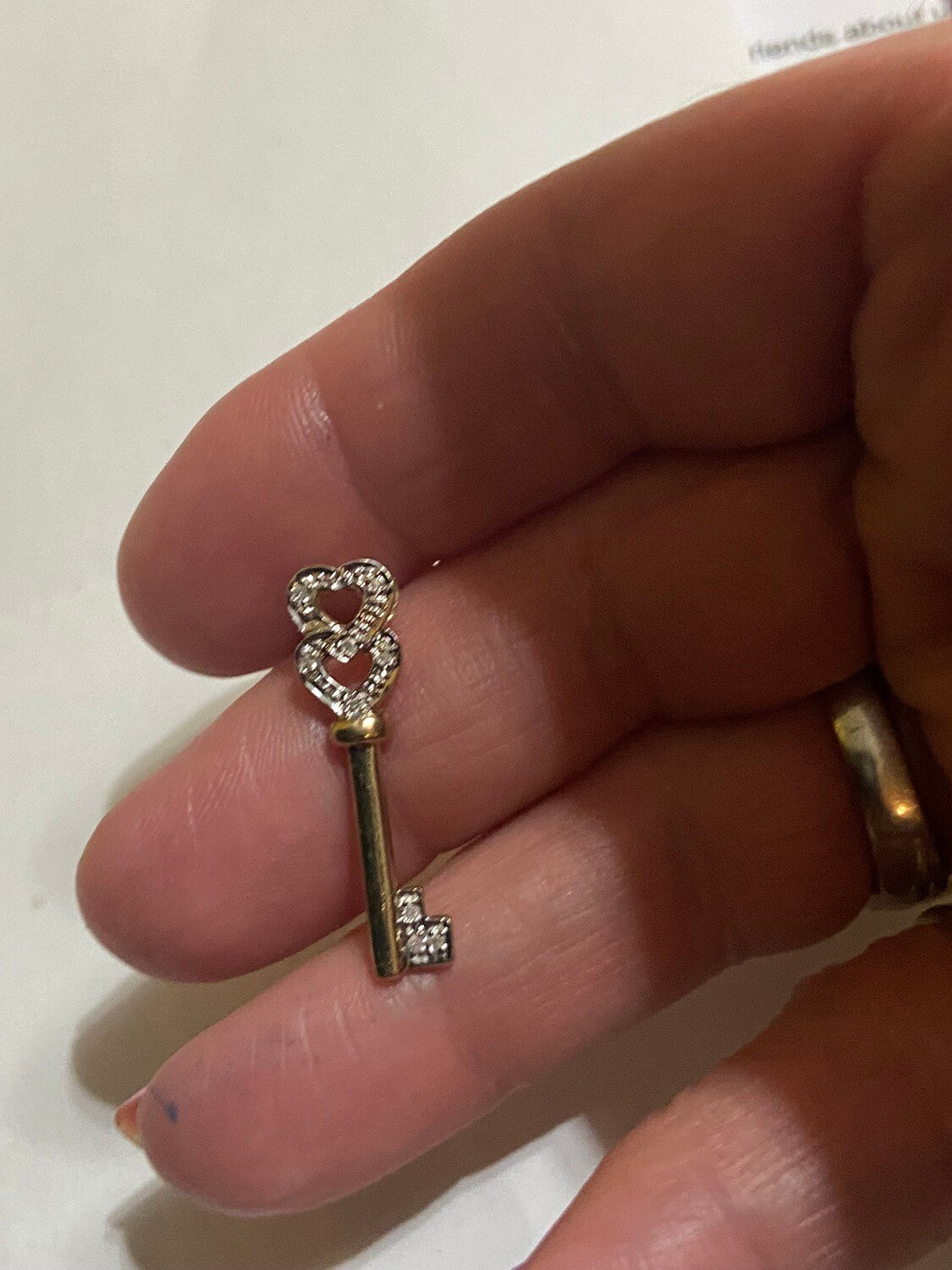 9ct vintage key charm with tow diamond hearts entwined as one