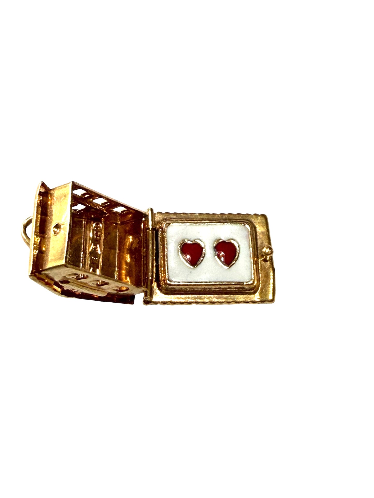 18ct vintage swiss chalet charm with two hearts inside.