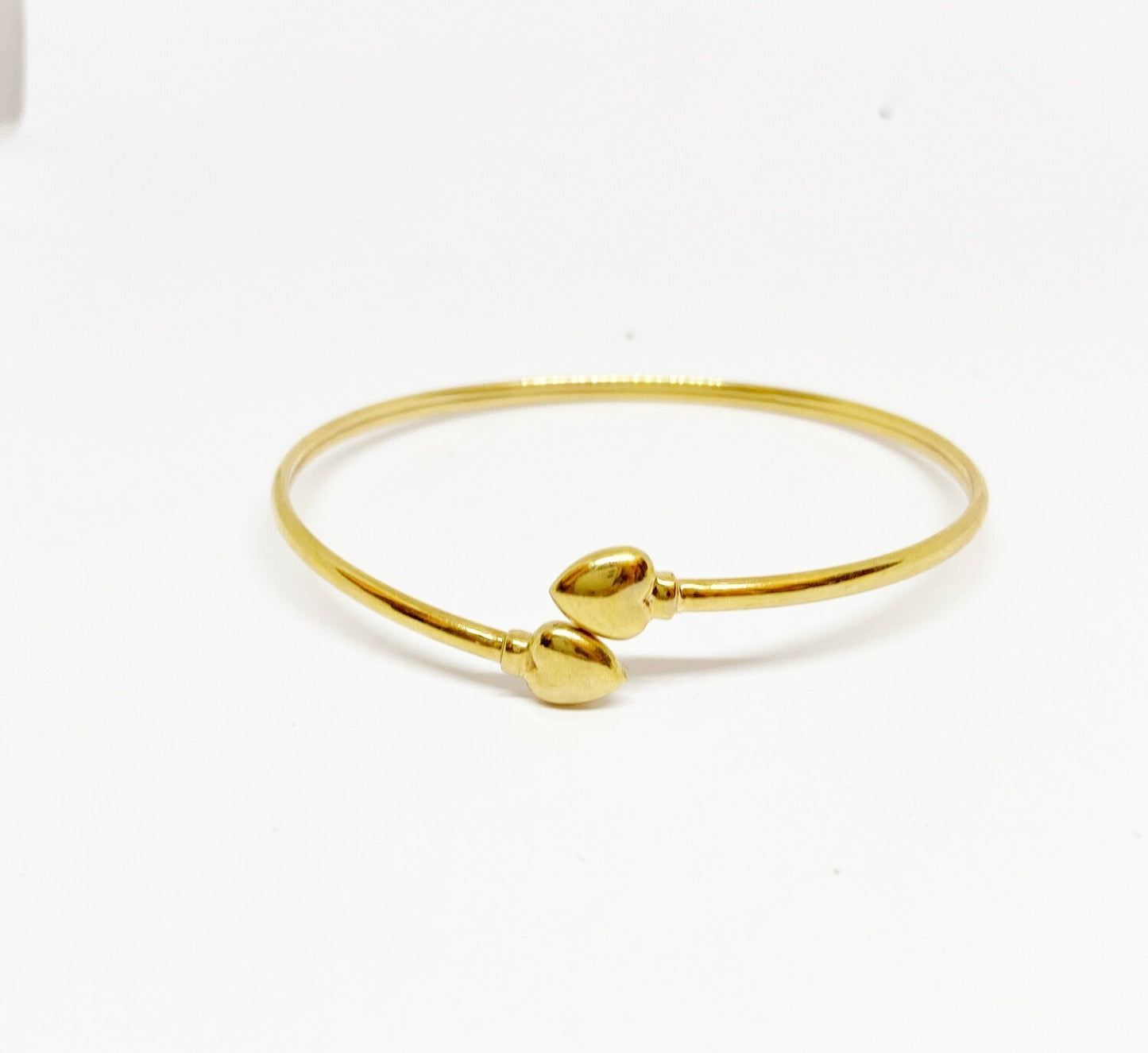 9ct pre owned bangle with two hearts