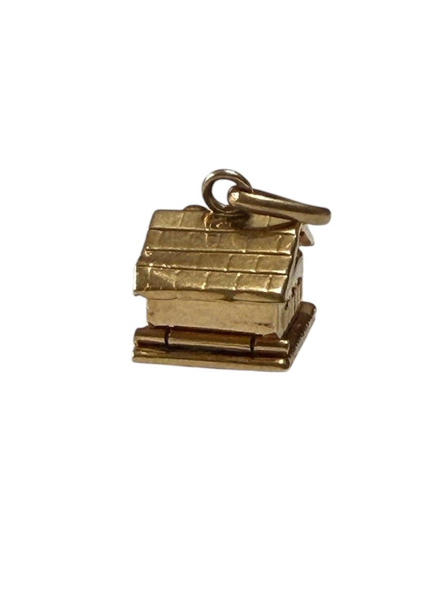 18ct vintage swiss chalet charm with two hearts inside.