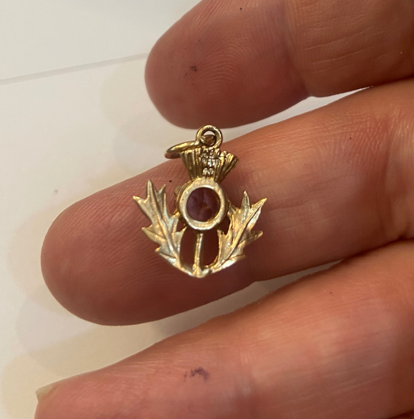 9ct vintage thistle charm with an amethyst. 1.4g