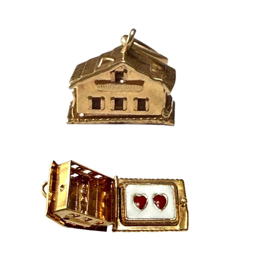 18ct vintage swiss chalet charm with two hearts inside.
