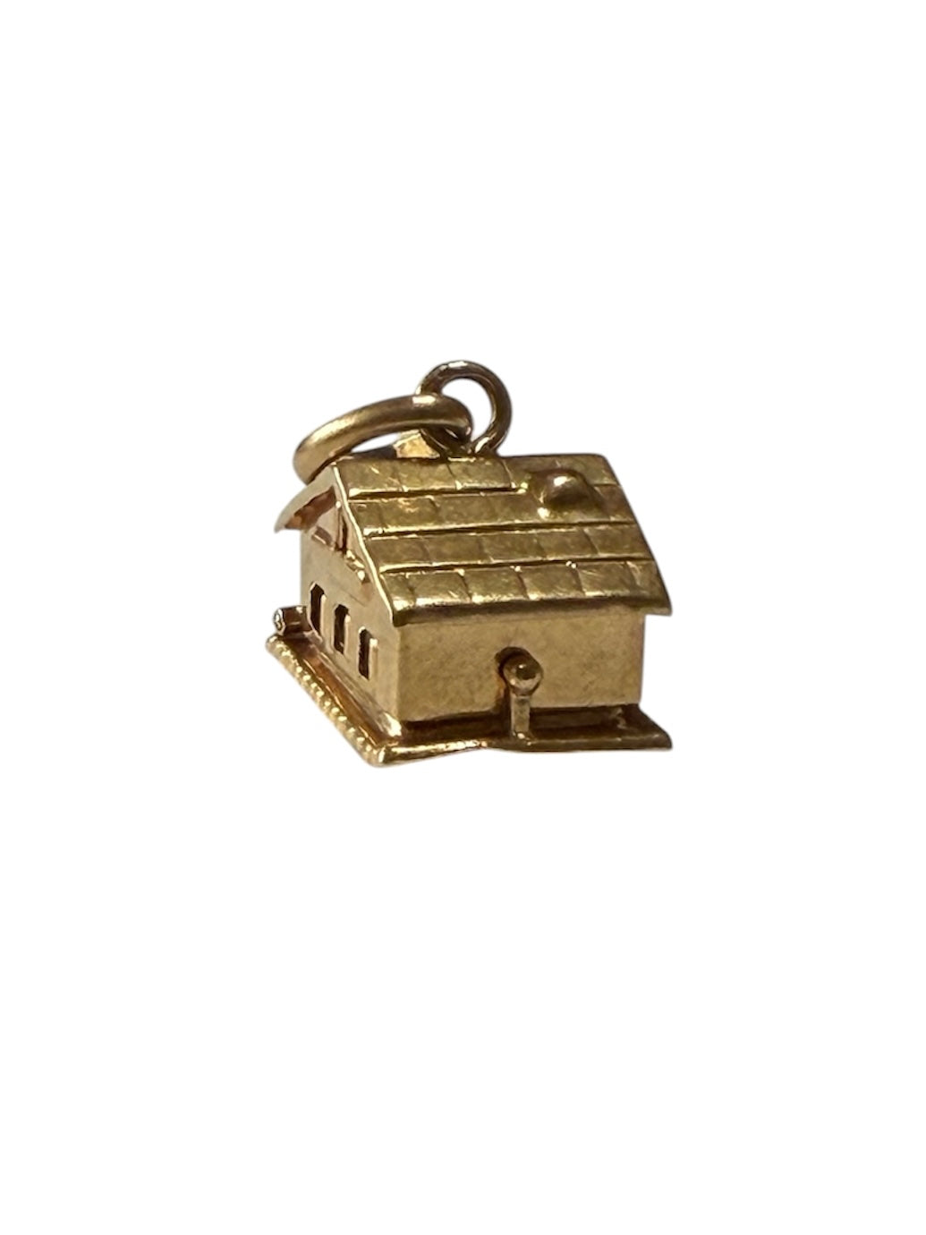 18ct vintage swiss chalet charm with two hearts inside.