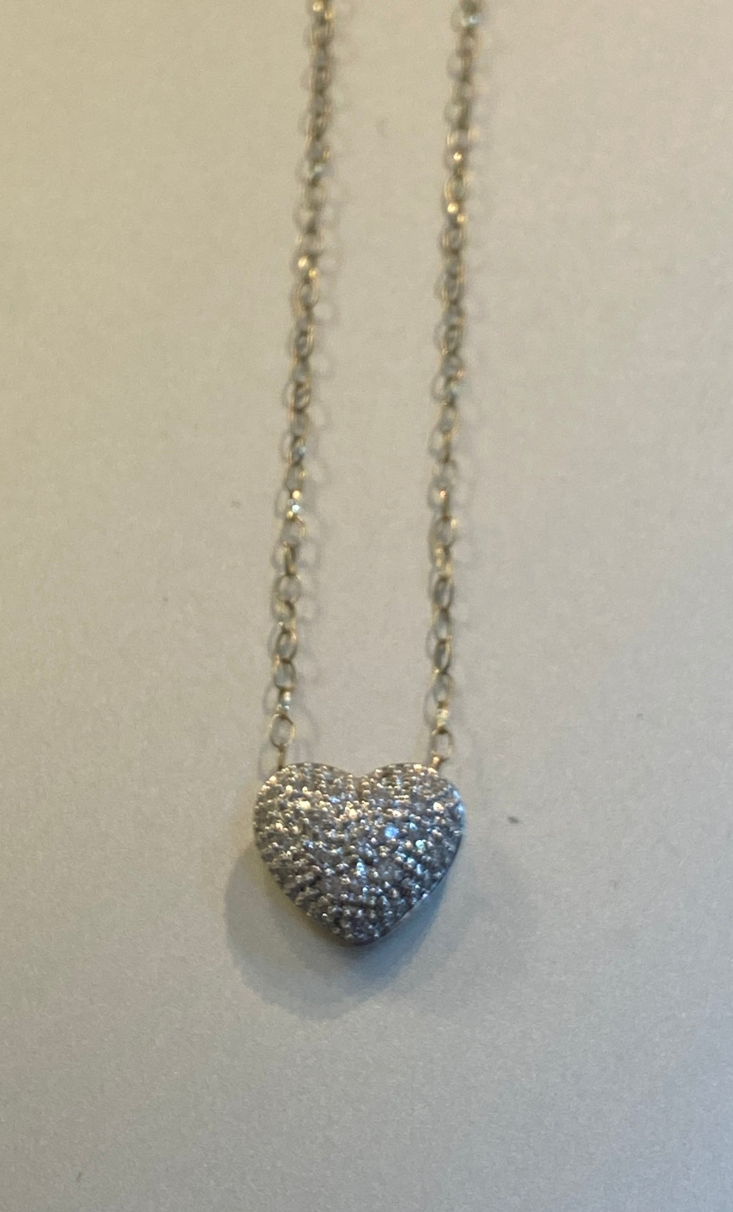 9ct pre owned diamond heart and chain. 16 inches