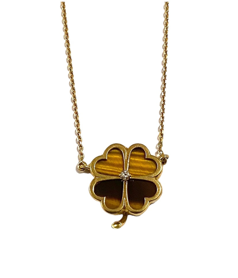 18ct 750 four leaf clover necklace set in tigers eye and a small central diamond