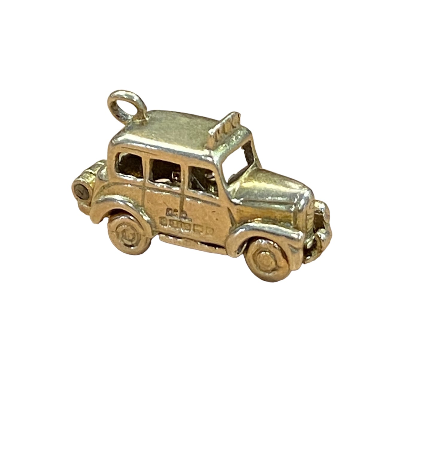 9ct vintage taxi charm opening to reveal some passengers inside circa 1963