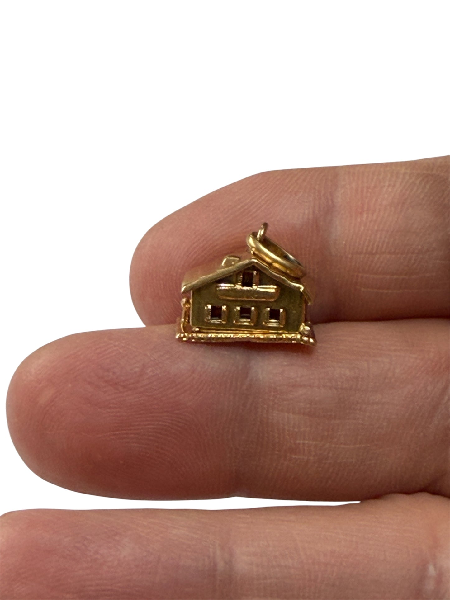 18ct vintage swiss chalet charm with two hearts inside.