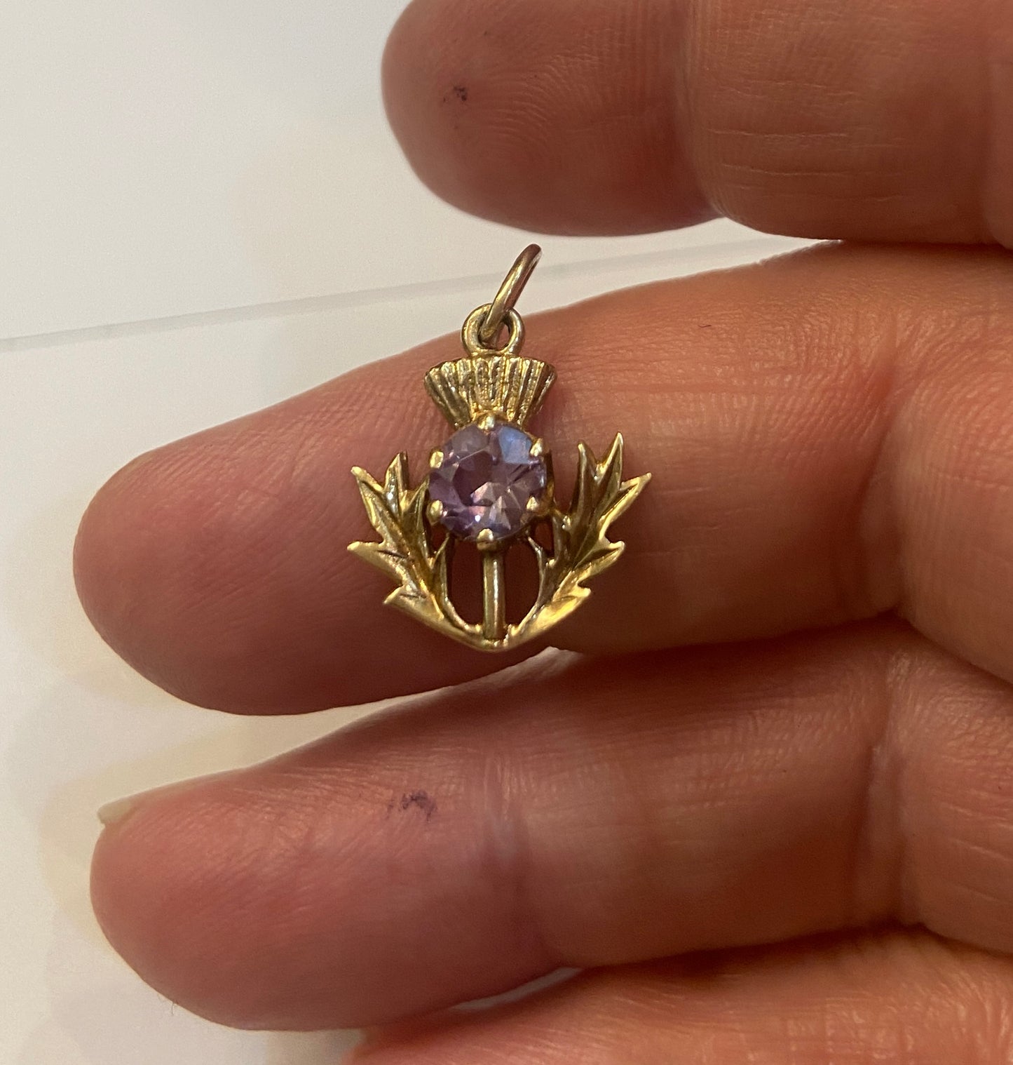 9ct vintage thistle charm with an amethyst. 1.4g