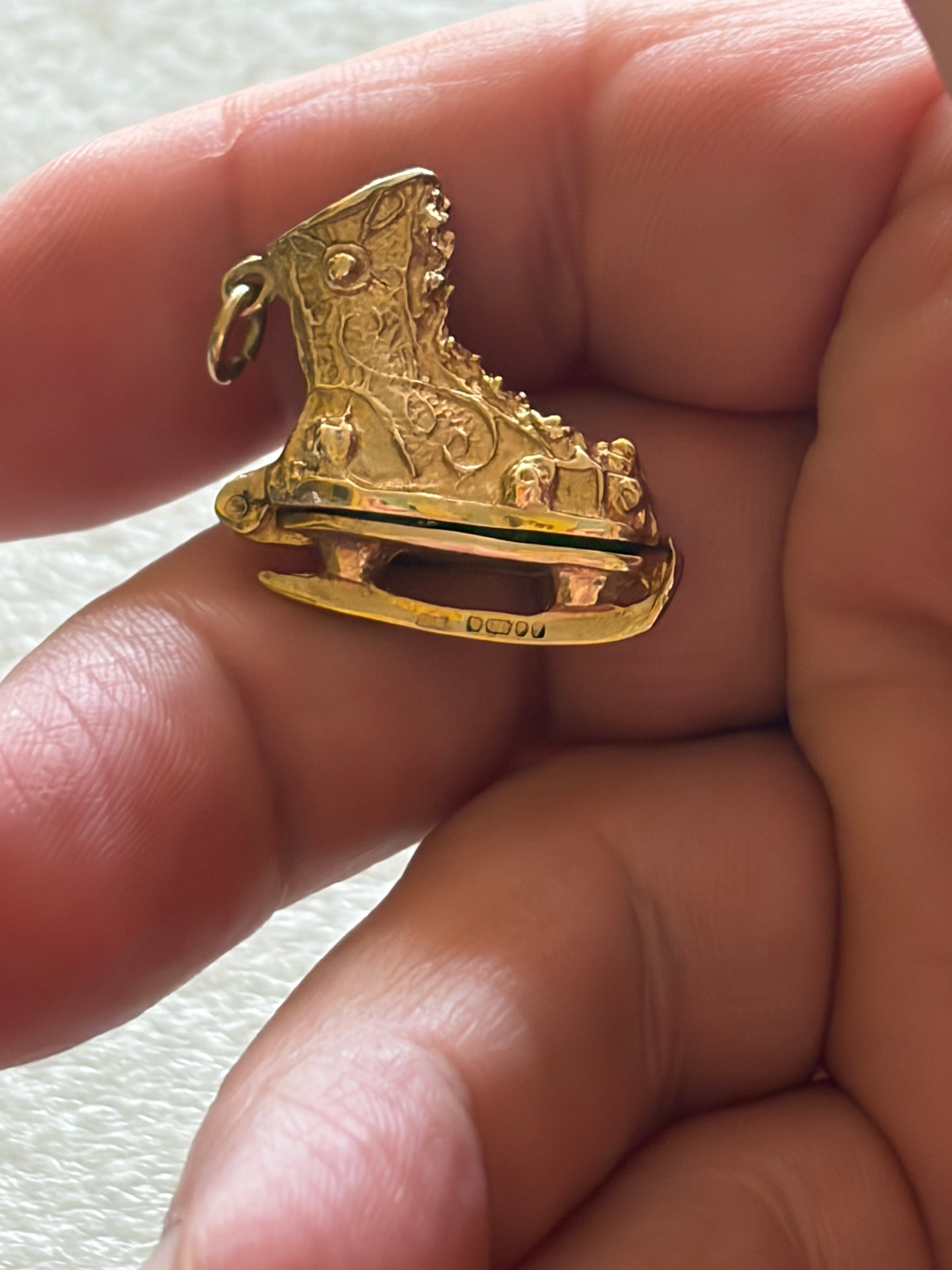 9ct vintage ice skate charm circa 1966 London with enamel skater inside. 6.2g