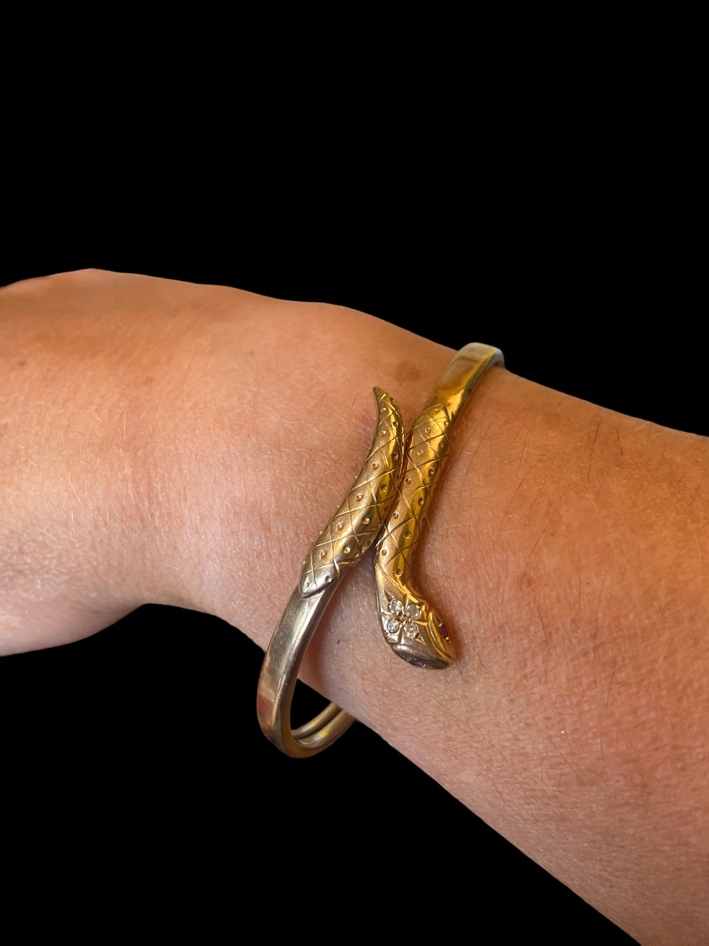 9ct vintage flexible snake bangle with diamond and ruby eyes.