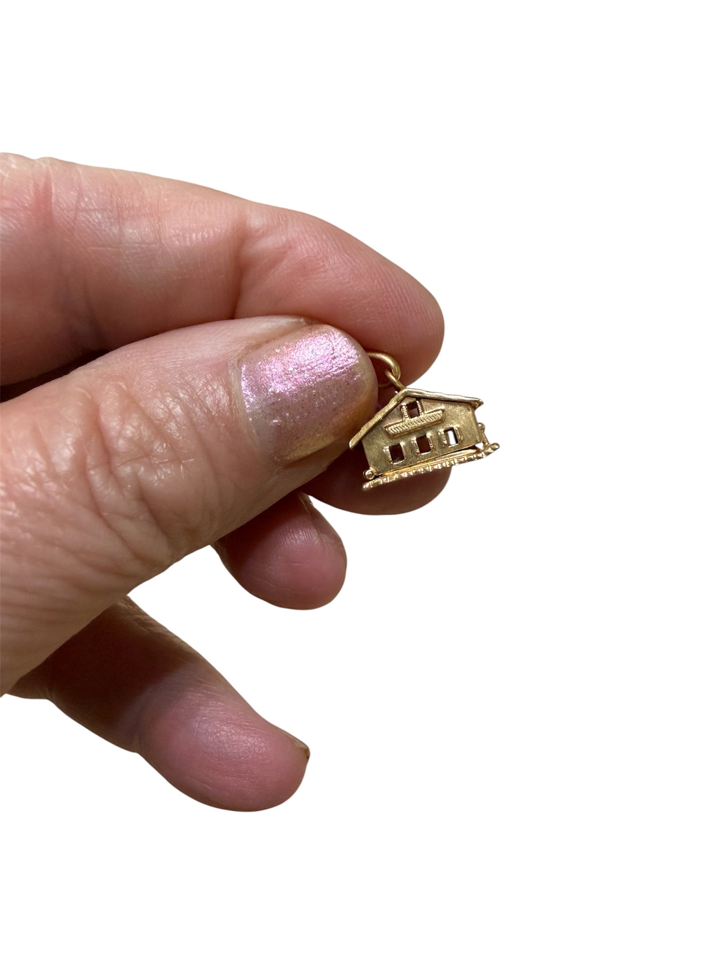 18ct vintage swiss chalet charm with two hearts inside.