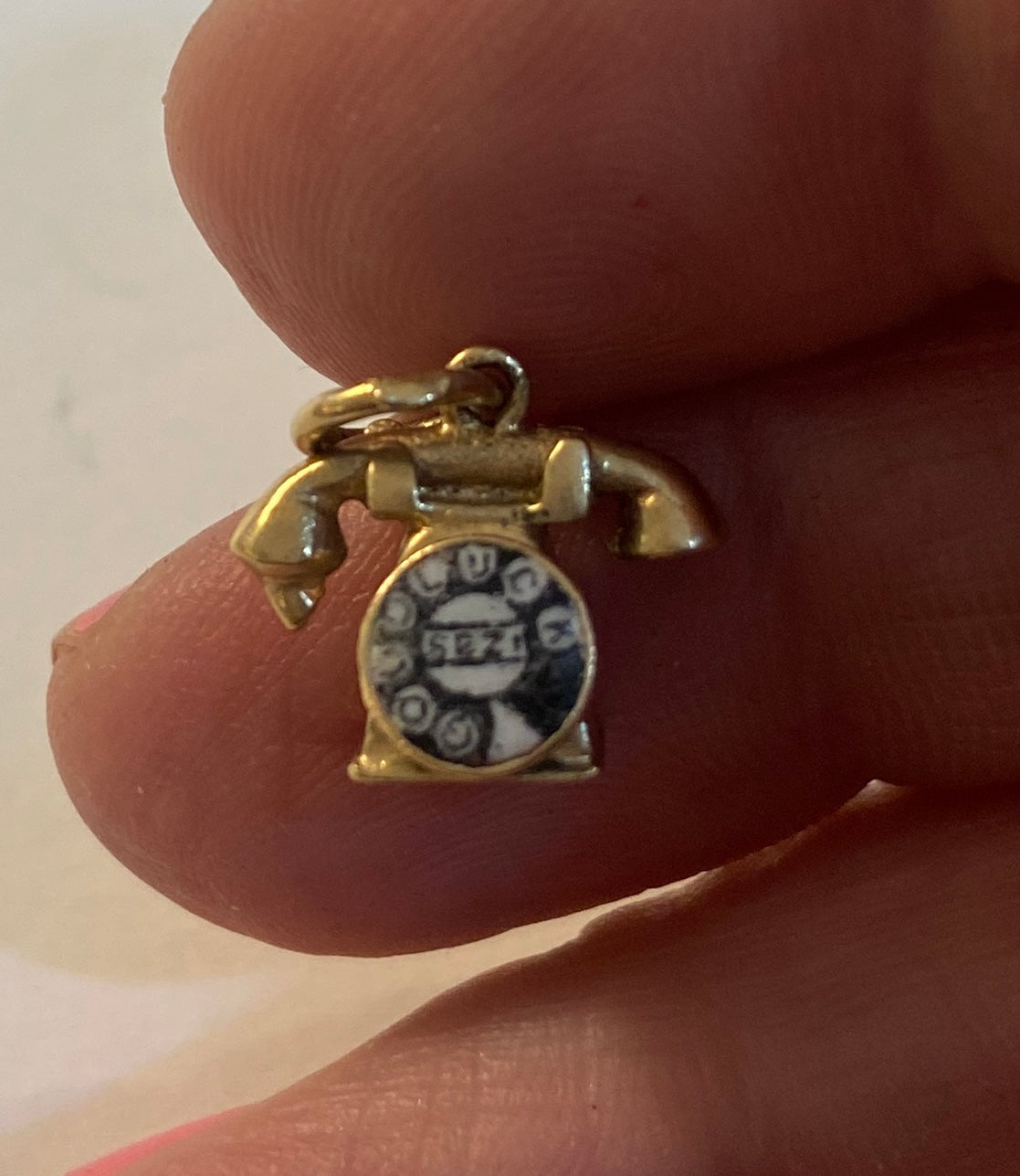 9ct vintage phone charm with 'good luck' on the dial circa 1963